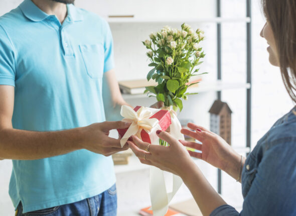 man-s-hand-giving-present-his-wife