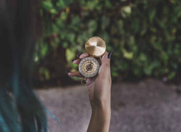 woman-looking-golden-vintage-compass-hand (1)